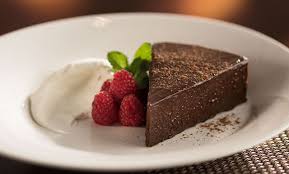 The Capital Grille signature dishes Porcini-rubbed Bone-in Ribeye with 15-year Aged Balsamic
Seared Tenderloin with Butter Poached Lobster Tails
Flourless Chocolate Espresso Cake